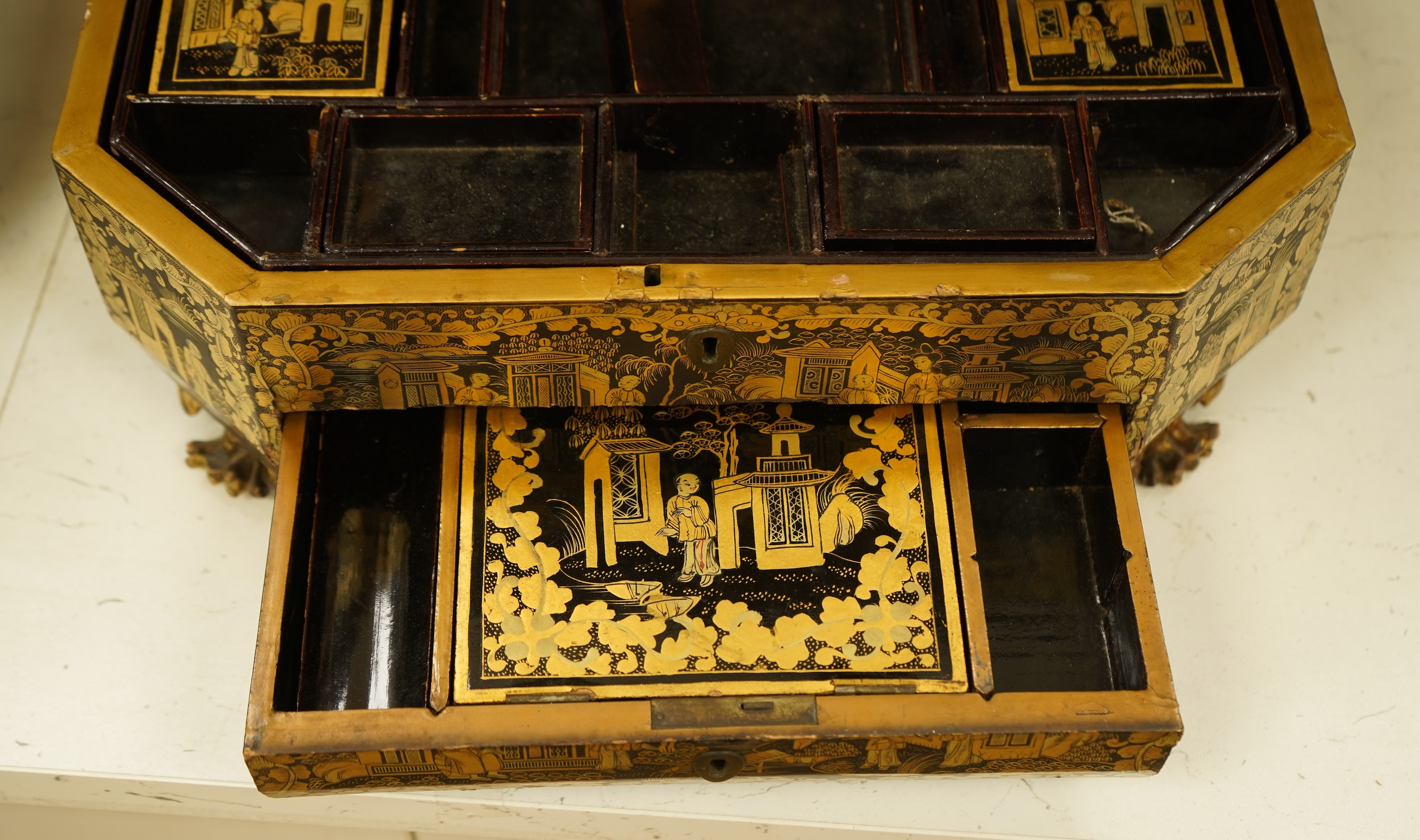 A Chinese export octagonal lacquered work box with fitted interior, 35cm wide